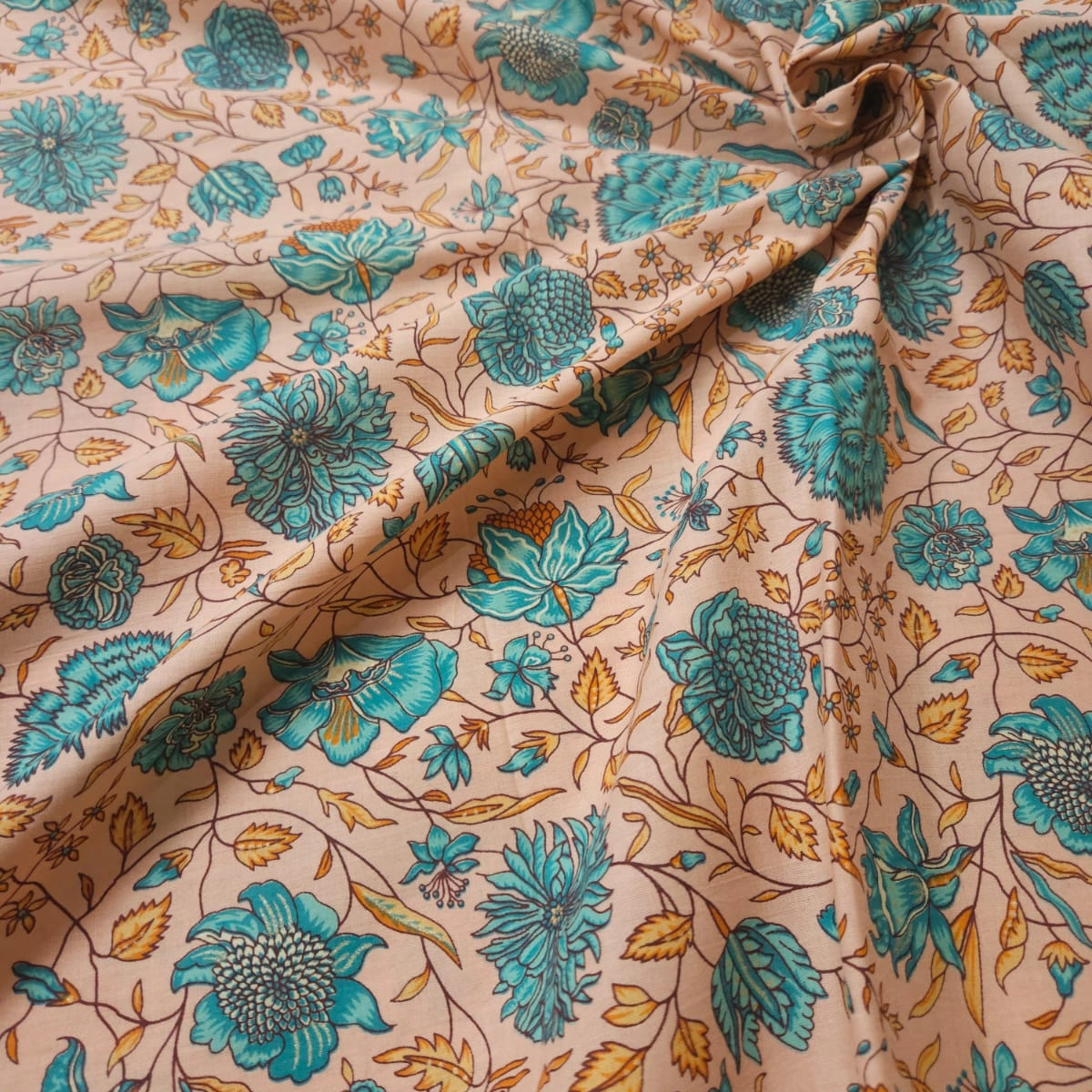 Peach orange shade base jaipuri nas flower jaal print on overall fabric, cotton fabric.