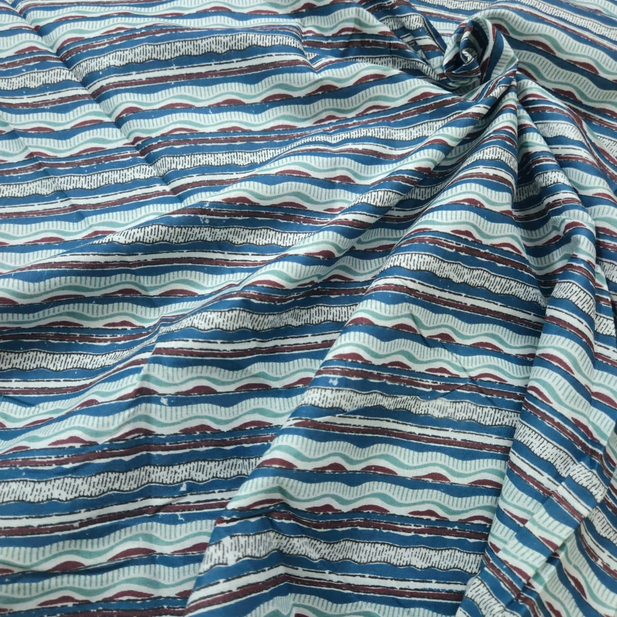 Blue and mehroon shade base stripes print on overall fabric, cotton fabric.